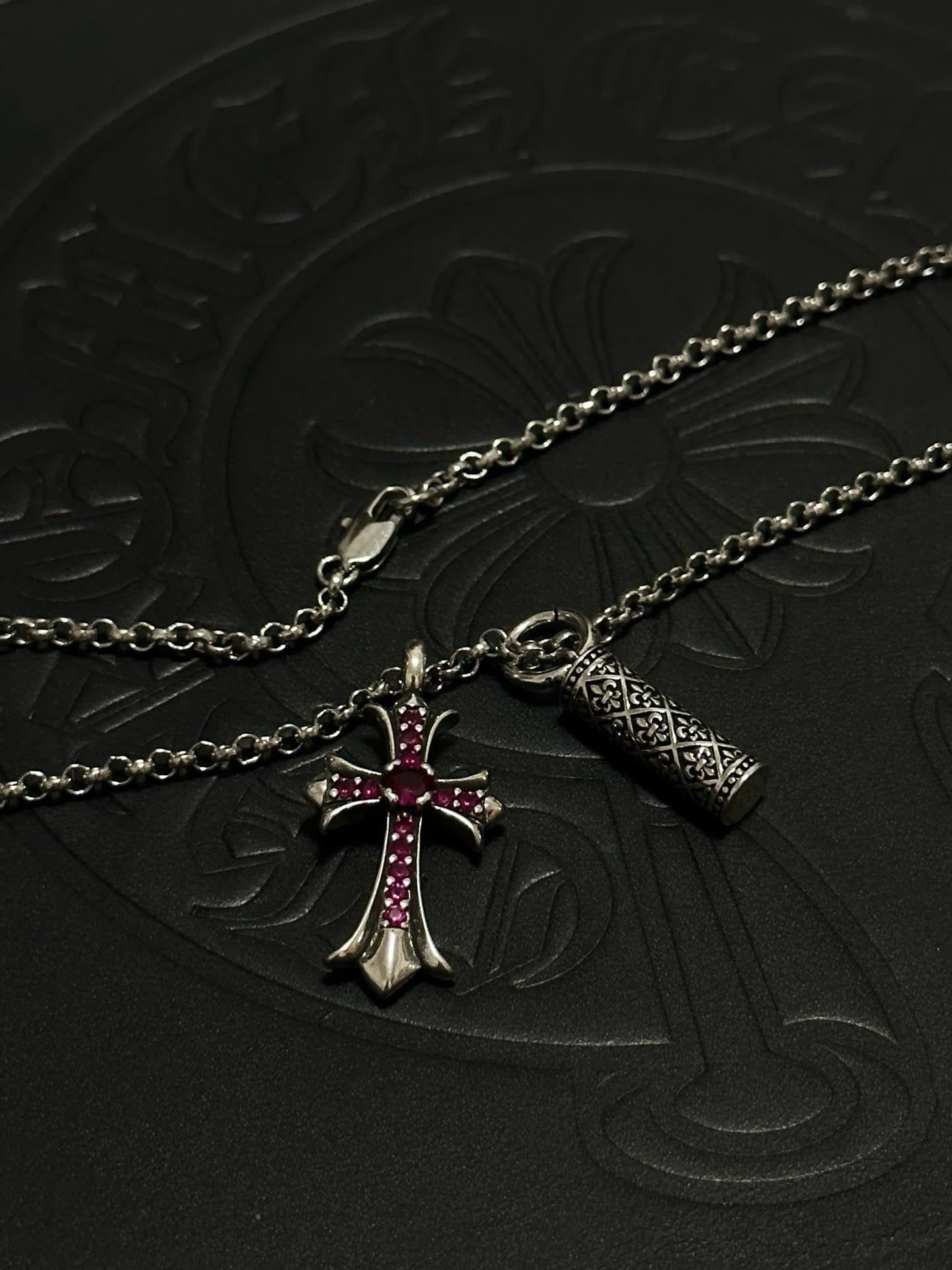 Chrome Hearts Silver Cross Pendant with Ruby Accents and cylindrical charm